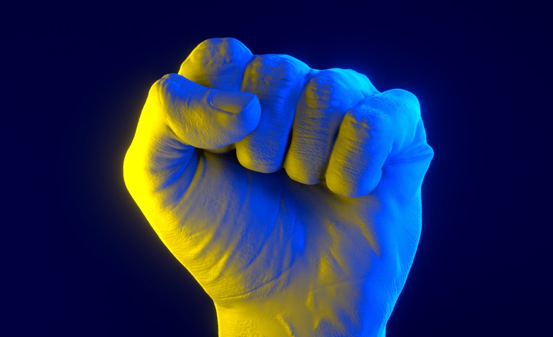 fist painted in the color of flag of Ukraine
