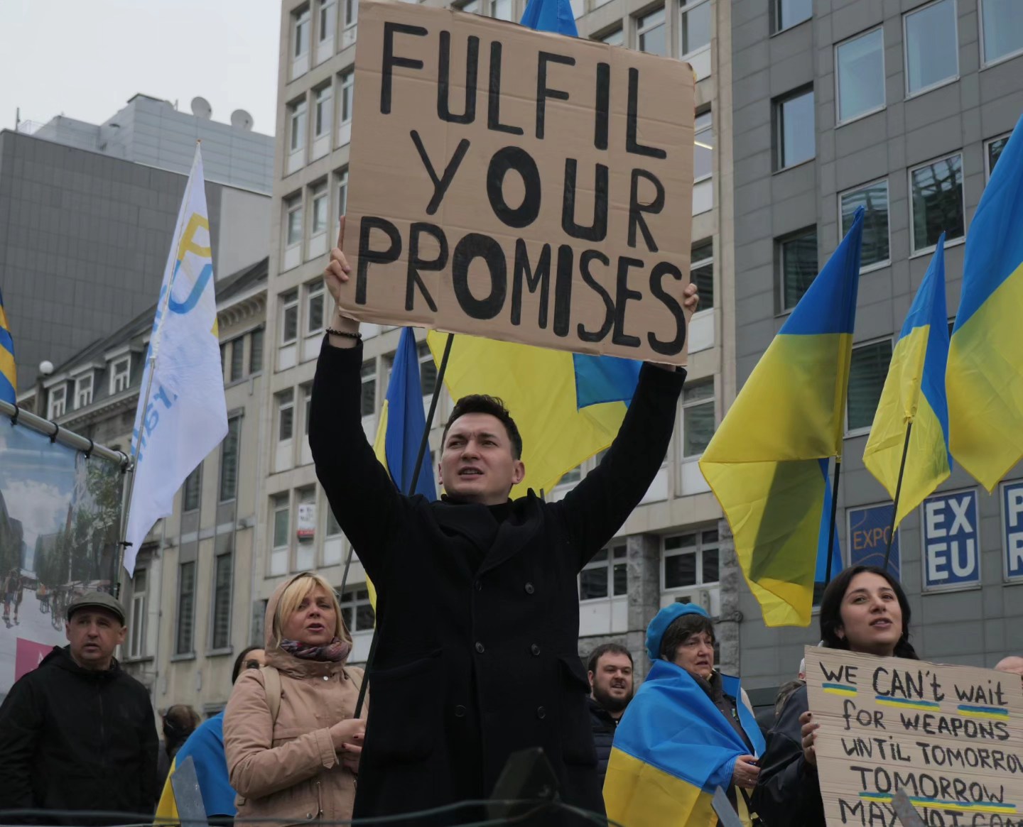 a demonstration in front of Le Berlaymont building which is a part of the Headquarters of the European Commission